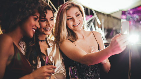 group of ladies taking a selfie on a night out