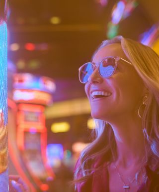 woman playing on a slot machine