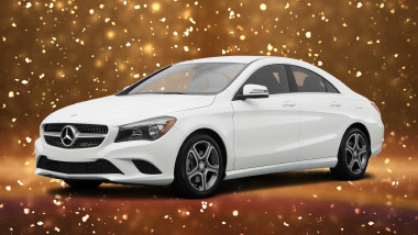white mercedes sedan on gold sparkle background