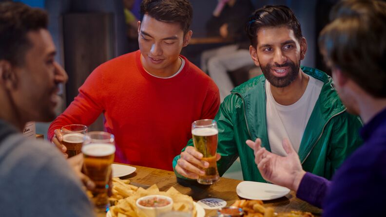 A group of friends enjoying drinks and food